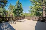 Enjoy the serene mountain views from this spacious deck, perfect for outdoor entertaining or quiet relaxation.