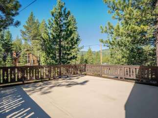 Enjoy the serene mountain views from this spacious deck, perfect for outdoor entertaining or quiet relaxation.