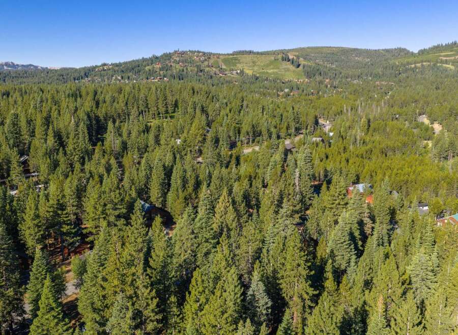 Nestled within a dense forest, this property offers a serene mountain retreat.