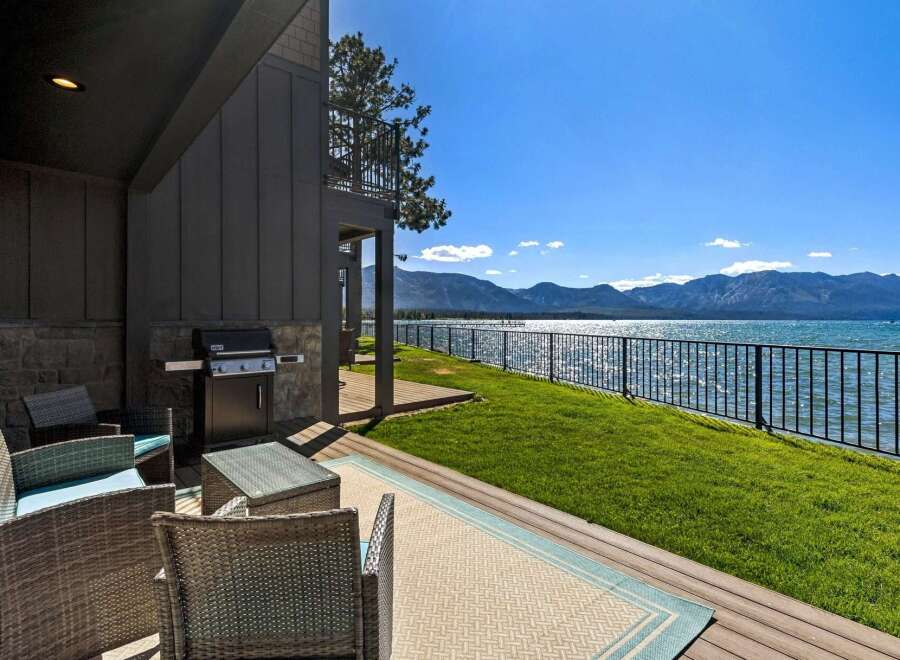 Enjoy breathtaking lake and mountain views from this stunning property's private patio.