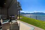 Enjoy breathtaking lake and mountain views from this stunning property's private patio.