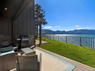 Enjoy breathtaking lake and mountain views from this stunning property's private patio.