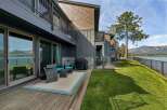 Enjoy breathtaking lake and mountain views from this stunning property's private deck, perfect for outdoor entertaining.