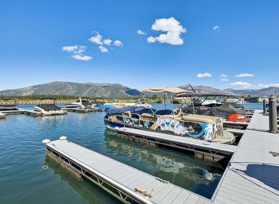Experience lakeside living with this stunning property featuring a private dock and boat slips, perfect for water enthusiasts.