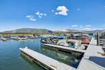 Experience lakeside living with this stunning property featuring a private dock and boat slips, perfect for water enthusiasts.