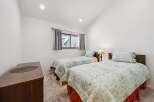 This charming bedroom features two comfortable twin beds, perfect for accommodating guests or family.