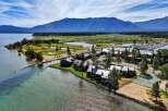 Experience lakeside living at its finest with this stunning aerial view of a waterfront property.