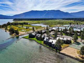 Experience lakeside living at its finest with this stunning aerial view of a waterfront property.