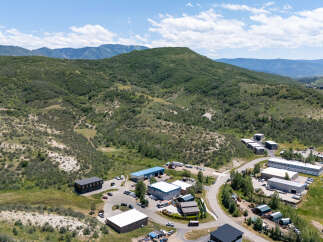 Discover this expansive commercial property nestled in a scenic mountain landscape.