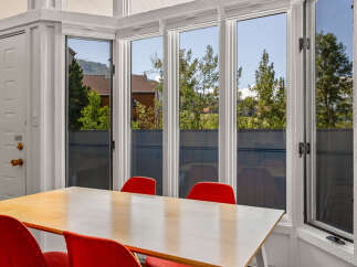 Enjoy bright, natural light in this dining area, perfect for meals or work.