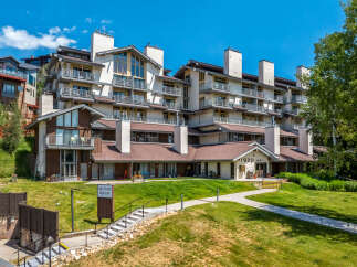 Discover luxury living at 1920 West, a stunning multi-story condominium complex nestled on a hillside with breathtaking views.