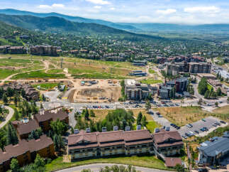 Experience luxury mountain living in this stunning aerial view of a ski resort community.