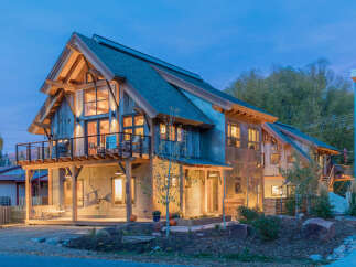 Experience modern mountain living in this stunning architectural gem, featuring a striking blend of natural wood and metal siding.
