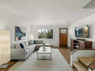 Step into this inviting living room, featuring a spacious sectional sofa perfect for relaxation and entertaining.