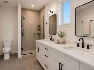 This modern bathroom features a spacious walk-in shower with tiled walls and a sleek glass door.