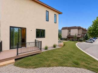 Experience modern living in this stunning property featuring a spacious deck perfect for outdoor relaxation and entertaining.
