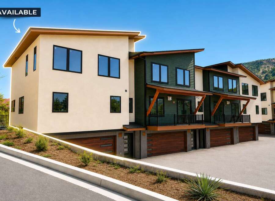 Discover modern living in this stunning townhome, featuring a sleek beige exterior and a contrasting dark green facade.