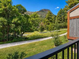 Experience the serene beauty of this mountain retreat, featuring a modern architectural design that seamlessly blends with the natural landscape.