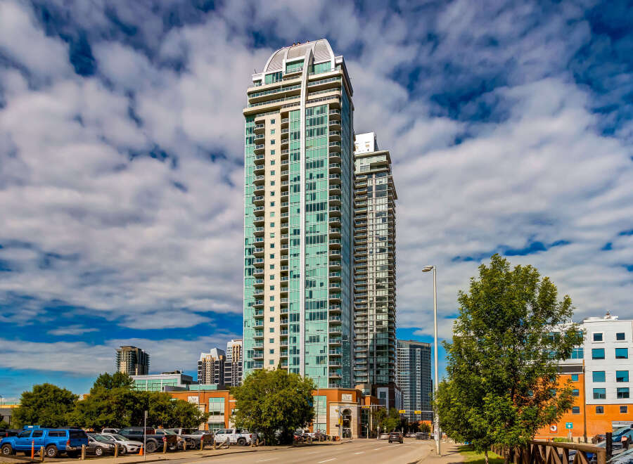 Experience modern urban living in this stunning high-rise condominium complex, featuring sleek architecture and panoramic city views.