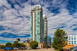 Experience modern urban living in this stunning high-rise condominium complex, featuring sleek architecture and panoramic city views.