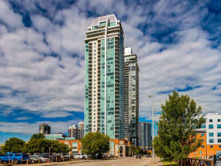 Experience modern urban living in this stunning high-rise condominium complex, featuring sleek architecture and panoramic city views.
