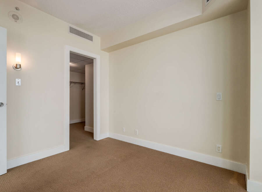 Step into this inviting room featuring a neutral color palette and plush carpeting, creating a serene atmosphere.