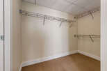 Discover ample storage in this spacious walk-in closet, featuring versatile wire shelving along multiple walls.