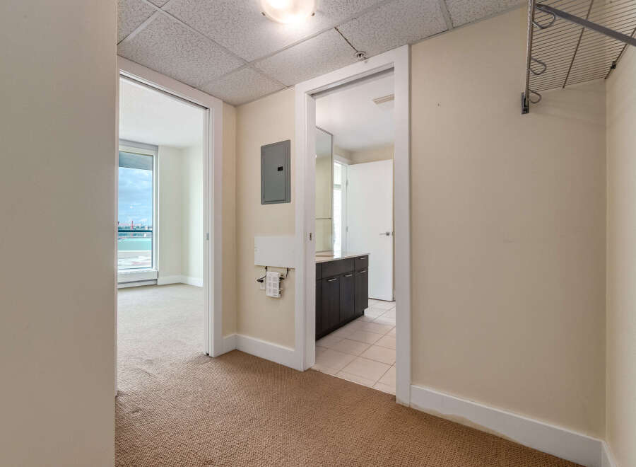 Discover this spacious apartment featuring a large living area with ample natural light streaming through expansive windows.