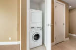 Discover convenience with this stacked Miele washer and dryer set, perfect for optimizing space in your laundry area.