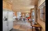 Experience rustic charm and modern comfort in this beautifully appointed dining and living area.
