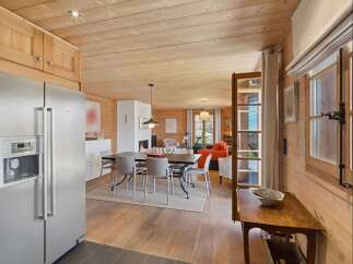 Experience rustic charm and modern comfort in this beautifully appointed dining and living area.
