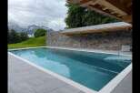 Experience luxury outdoor living with this stunning infinity pool, perfectly integrated into a breathtaking mountain landscape.