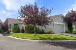 Discover this charming single-family home featuring a well-maintained lawn and mature trees, perfect for enjoying the outdoors.