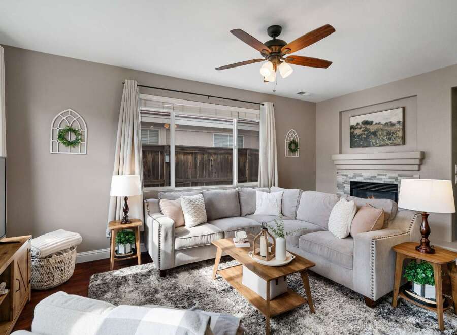 Cozy living room featuring a plush sectional sofa centered around a rustic coffee table, perfect for family gatherings.