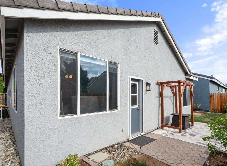 Discover this charming home featuring a stucco exterior and a durable tile roof.