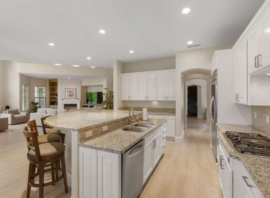 Experience luxury living in this stunning open-concept kitchen and living area.