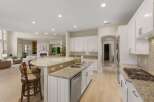 Experience luxury living in this stunning open-concept kitchen and living area.