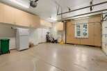 This spacious garage offers abundant storage with extensive built-in cabinetry, perfect for organizing tools and equipment.