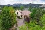 Nestled amidst lush greenery and majestic mountains, this stunning residence offers a serene escape.