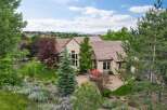 Experience luxury living in this stunning estate, featuring a sprawling backyard with a paved patio perfect for outdoor entertaining.