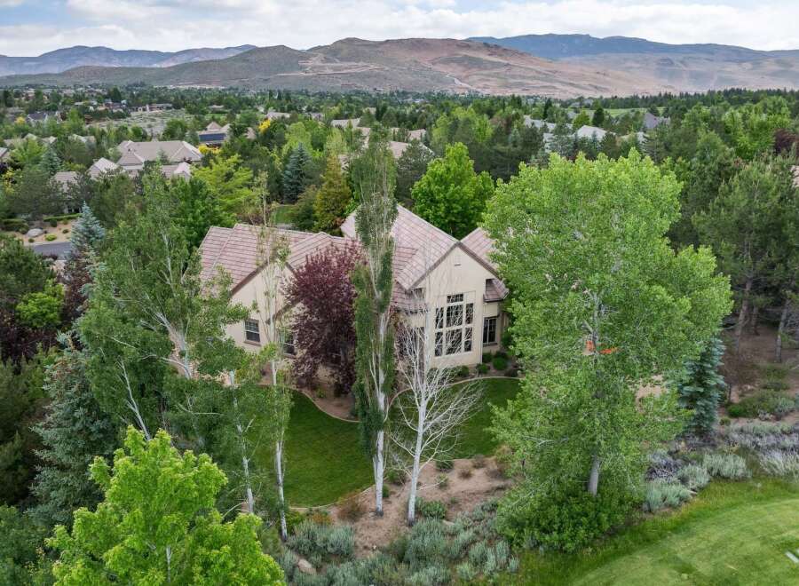 Experience luxury living in this stunning estate, nestled amidst lush greenery and mature trees.
