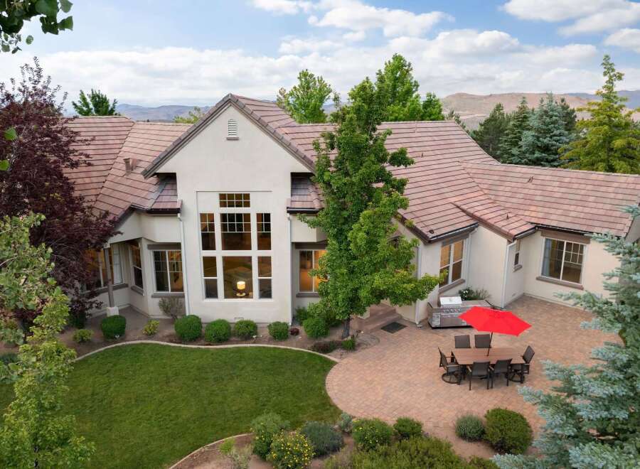 Experience luxury living in this stunning home featuring a spacious backyard patio perfect for entertaining.