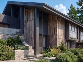 Experience modern luxury in this stunning home featuring a striking blend of natural wood and dark metal siding.