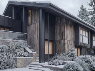 Experience modern mountain living in this stunning architectural home, featuring a striking combination of dark metal siding and rustic wood accents.