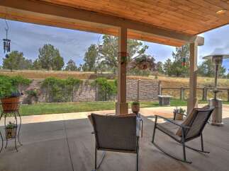 Enjoy outdoor living on this spacious patio, perfect for entertaining or relaxing.