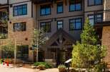 Discover luxury living in this stunning property featuring a modern exterior with stone and siding accents.