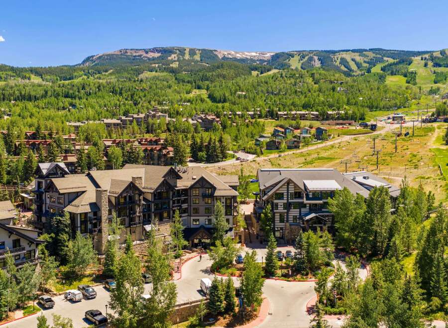 Experience luxury mountain living in this stunning property, nestled amidst lush greenery and offering breathtaking views of the ski slopes and surrounding peaks.