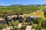 Experience luxury mountain living in this stunning property, nestled amidst lush greenery and offering breathtaking views of the ski slopes and surrounding peaks.