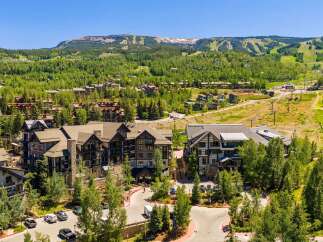 Experience luxury mountain living in this stunning property, nestled amidst lush greenery and offering breathtaking views of the ski slopes and surrounding peaks.