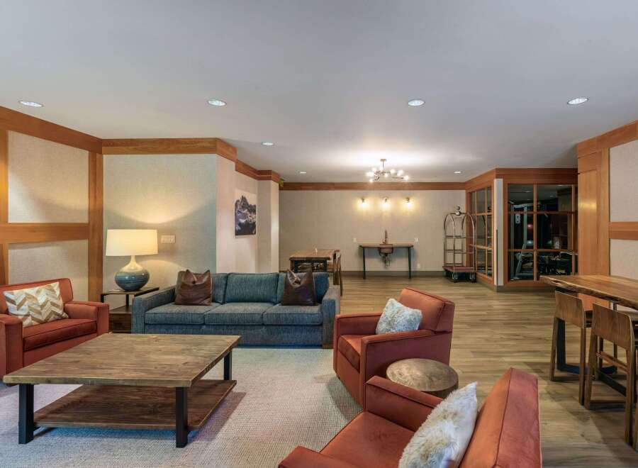 Experience comfort and style in this inviting living space, featuring plush seating arrangements perfect for relaxation.